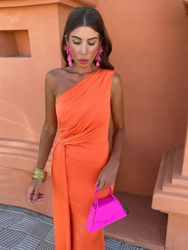 Elegant orange A-line sleeveless dress for women, perfect as a flattering wedding guest or party outfit.