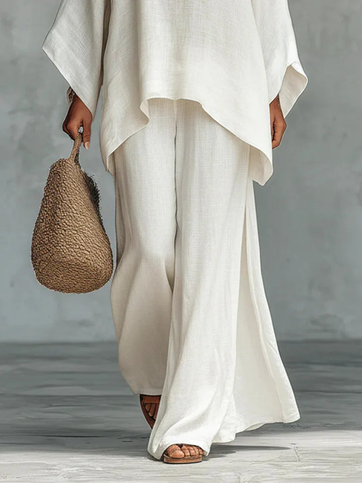 Stylish women's asymmetrical wide-leg pant set. Matching two-piece for elegant comfort.
