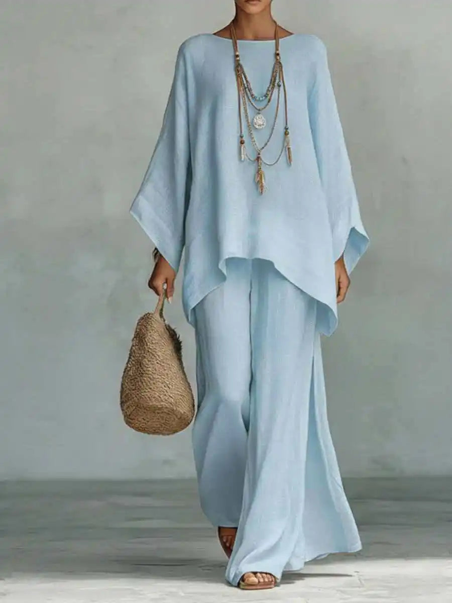 Relaxed fit women's asymmetrical two-piece pant set, featuring comfortable wide-leg pants. Elegant casual.