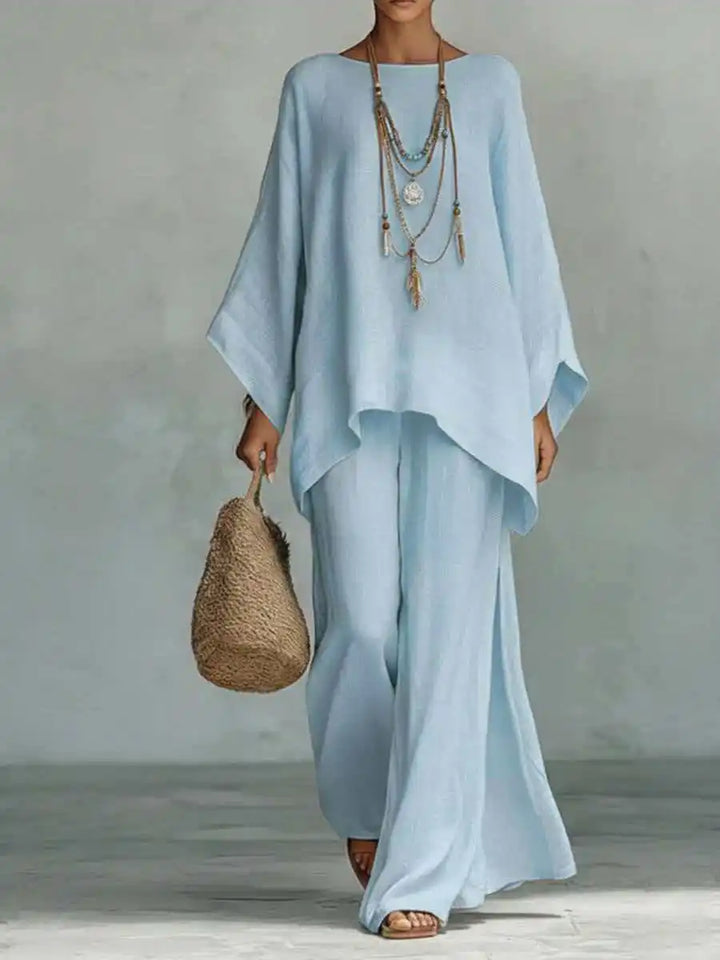 Relaxed fit women's asymmetrical two-piece pant set, featuring comfortable wide-leg pants. Elegant casual.