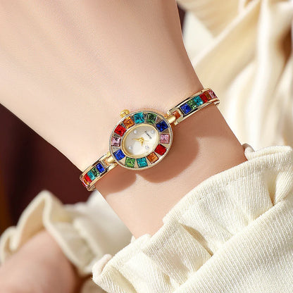 Luxurious gold women's elegant Aurora gemstone watch, non-tarnish and scratch-resistant, a stunning jewelry watch.