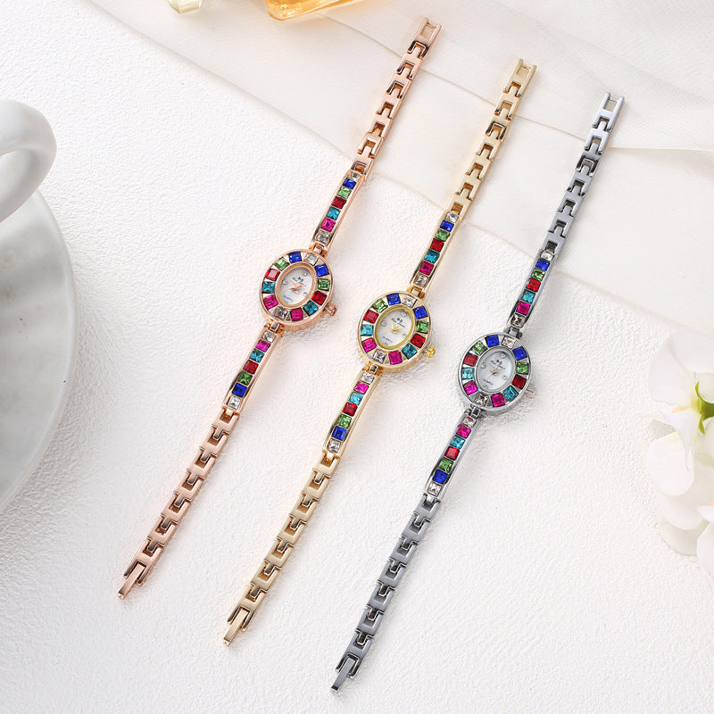 Scratch-resistant & non-tarnish women's Aurora gemstone watch, an elegant gold fashion accessory with oval dial.