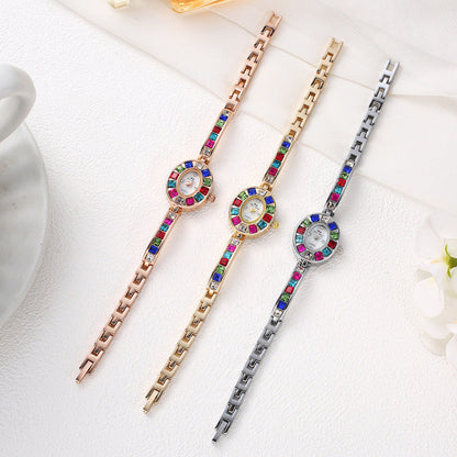 Scratch-resistant & non-tarnish women's Aurora gemstone watch, an elegant gold fashion accessory with oval dial.