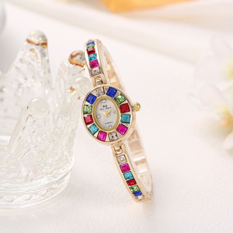 Stylish women's elegant Aurora gemstone watch, a versatile fashion accessory to complement any outfit, available in gold.