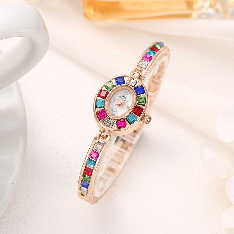 Elegant women's Aurora gemstone watch in silver, featuring a unique oval dial and scratch-resistant finish for daily wear.