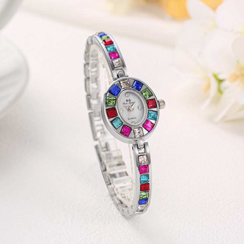 Rose gold elegant Aurora gemstone watch, a stunning women's jewelry watch with an oval dial and non-tarnish quality.