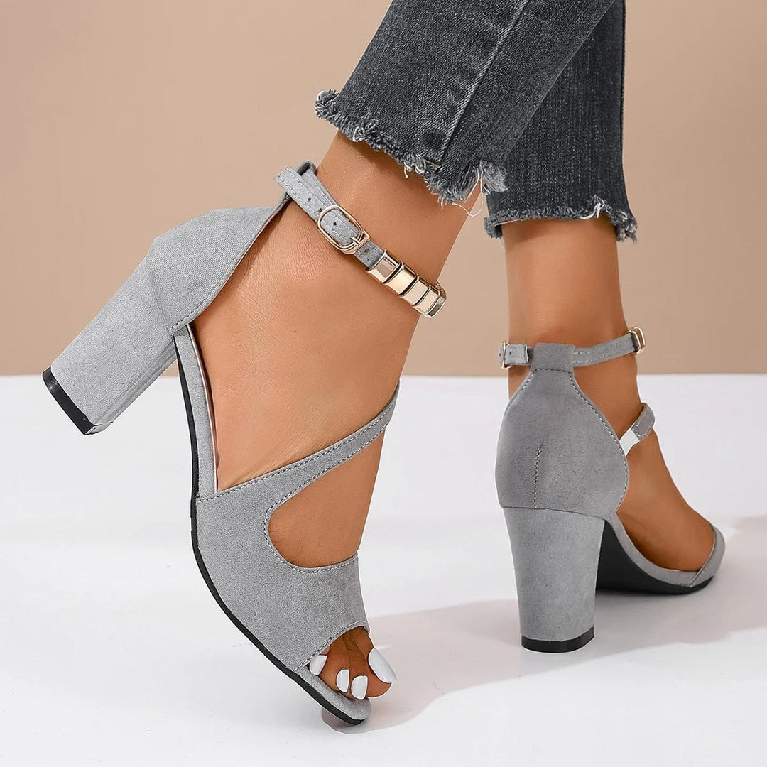 Women's comfortable open toe block heel sandals with sparkling beaded ankle strap styled on a foot.