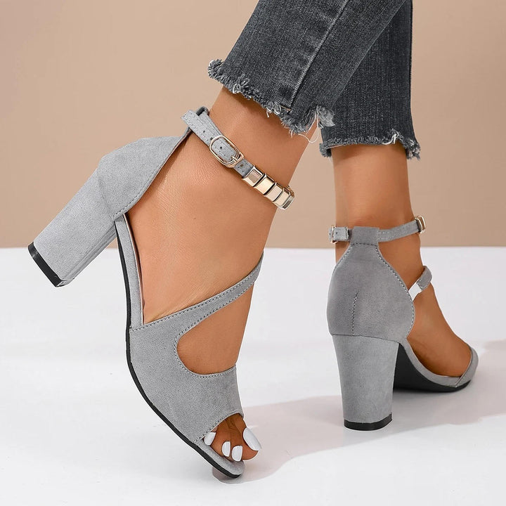 Women's comfortable open toe block heel sandals with sparkling beaded ankle strap styled on a foot.