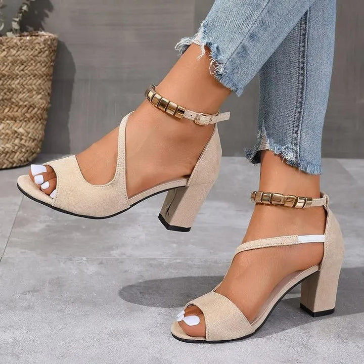 Stylish women's block heel sandals with an open toe and beaded ankle strap, offering comfort for versatile wear.