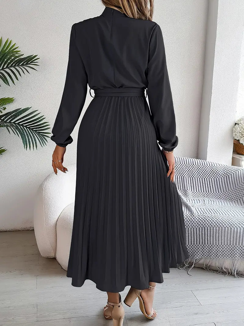 Elegant women's autumn midi dress, belted at the waist, with long sleeves & a flowing pleated skirt.