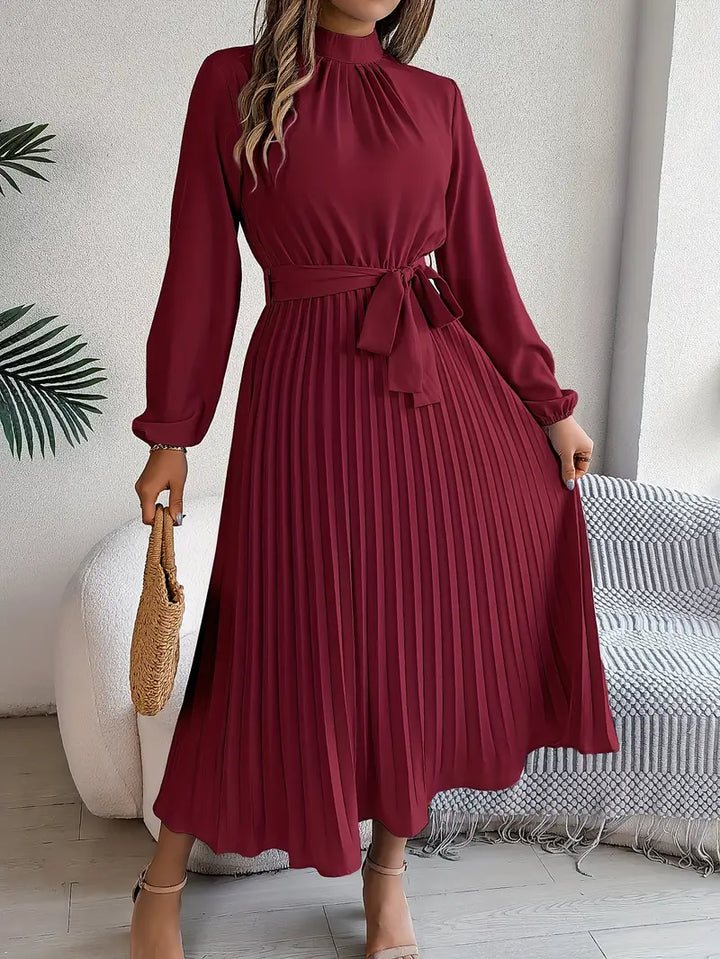 Versatile women's pleated midi dress with long sleeves & a flattering belted silhouette.