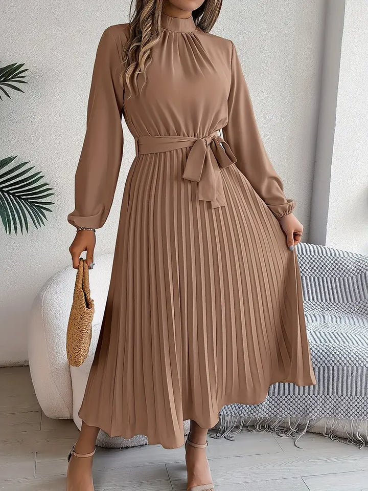 Women's occasion dress: elegant belted pleated midi style with comfortable long sleeves.