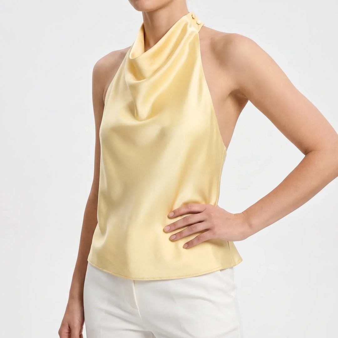 Fashionable women's evening top: a sleeveless, backless halter with a sophisticated draped design.