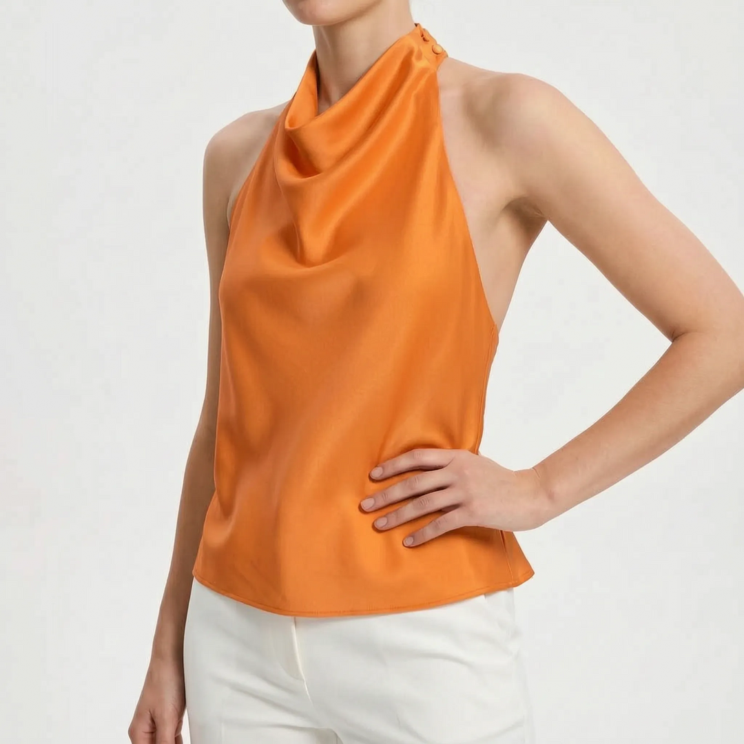 Sophisticated women's evening wear: a sleeveless draped halter top, perfect for a stylish party look.