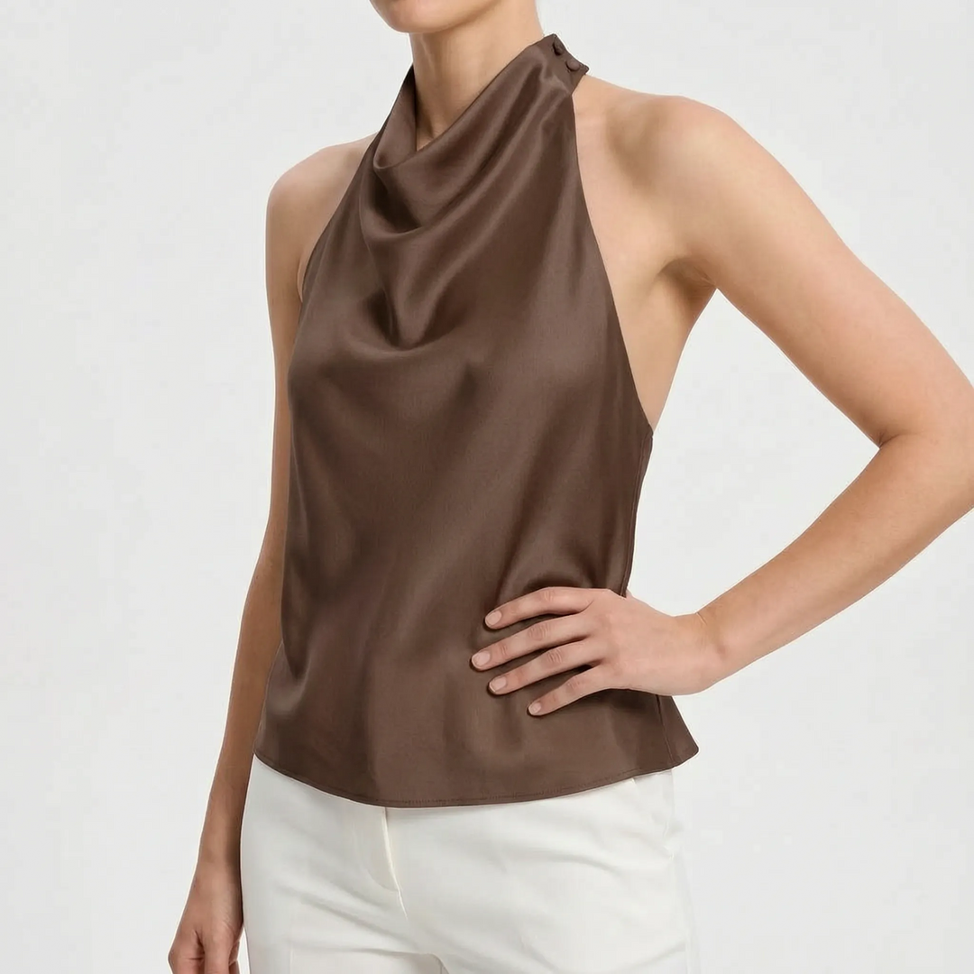 Elegant women's party top: a sleeveless draped halter with a backless design, perfect for sophisticated evenings.