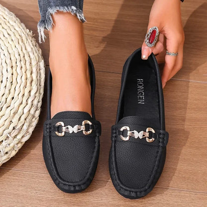 Everyday style women's loafers: elegant black with a decorative crystal.