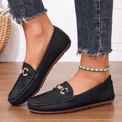Black women's loafers with crystal chain, offering a versatile polished look.