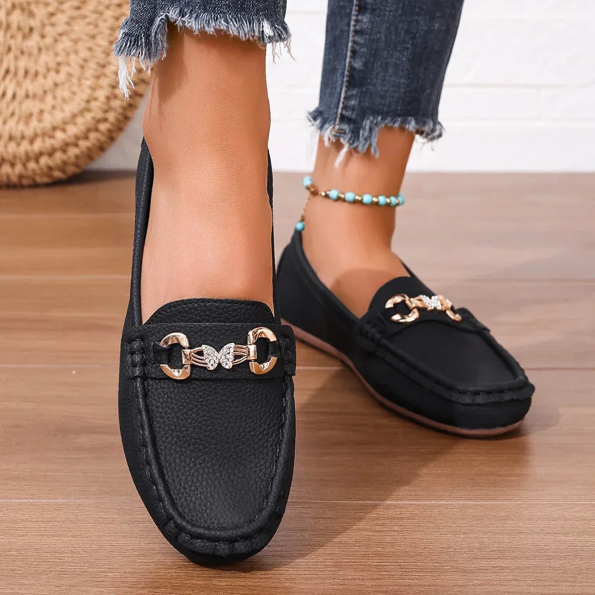 Women's slip-on footwear: elegant loafers with a beautiful crystal chain.