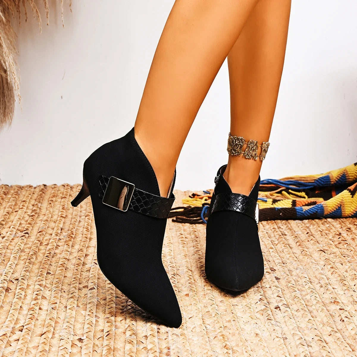 Elegant women's black pointed heels featuring a sleek slim heel and cushioned support.