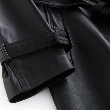 Fashionable women's black trench coat, a sophisticated and versatile long outerwear piece for modern chic style.