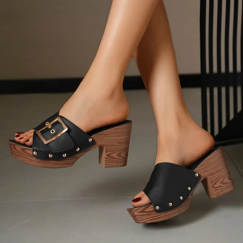 Women's sleek block heel slides with a modern buckle, offering elegance and comfort for daily use.