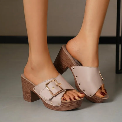 Stylish women's dress shoes: elegant block heel slides featuring a fashionable buckle detail.