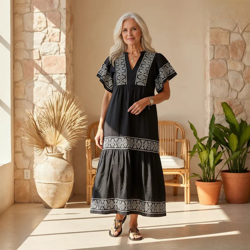 Women's elegant boho midi dress with intricate embroidery, perfect for spring/summer fashion.