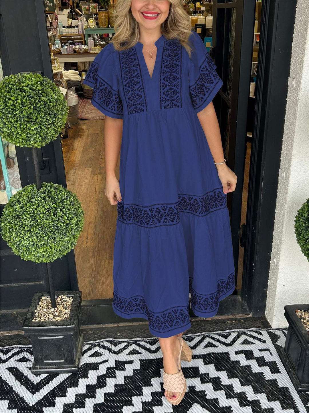 Full view of a women's casual boho midi dress, featuring beautiful embroidery and a flattering A-line cut.