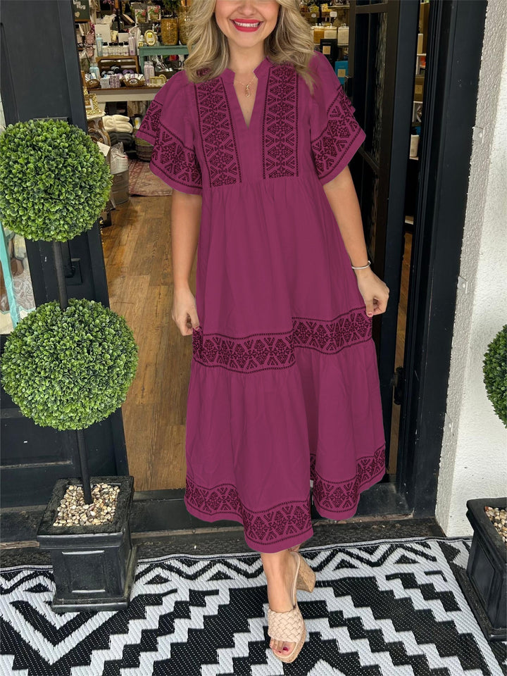 Flowing women's embroidered A-line boho midi dress, offering comfort and style for sunny spring and summer.
