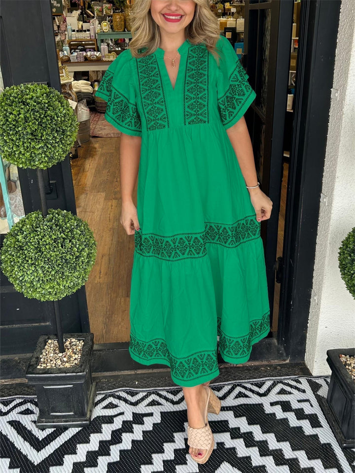 Distinctive women's elegant boho midi dress, showcasing unique embroidery and a flattering A-line silhouette.