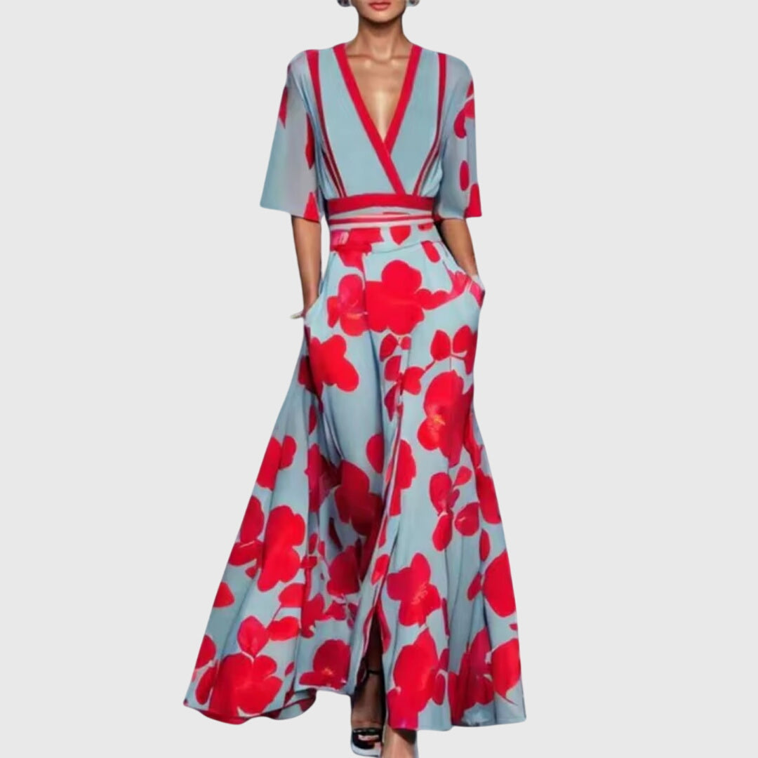 Statement women's bold floral maxi dress with deep V-neck and flowy design, great for elegant summer occasions.
