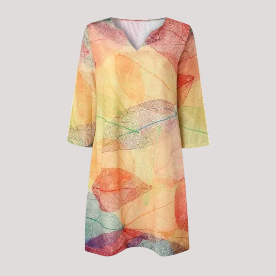 Stylish women's floral midi day dress featuring a vibrant botanical print, comfortable for summer fashion.