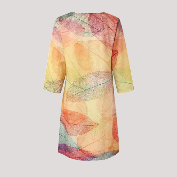 Effortless women's summer midi dress with a beautiful botanical print, V-neck, and short sleeves.