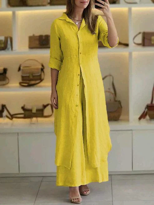 Model wearing a chic women's button-down maxi shirt dress with 3/4 sleeves, styled for a relaxed summer day.
