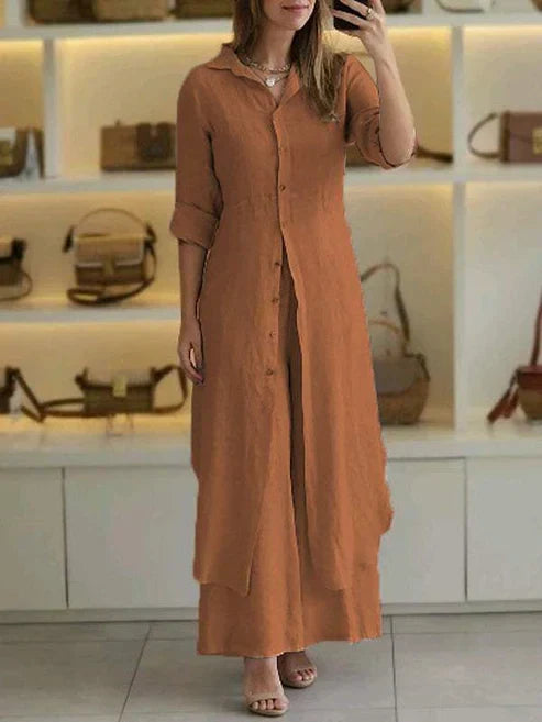 Front view of a women's button-down maxi shirt dress, showcasing 3/4 sleeves, spread collar & full button placket.