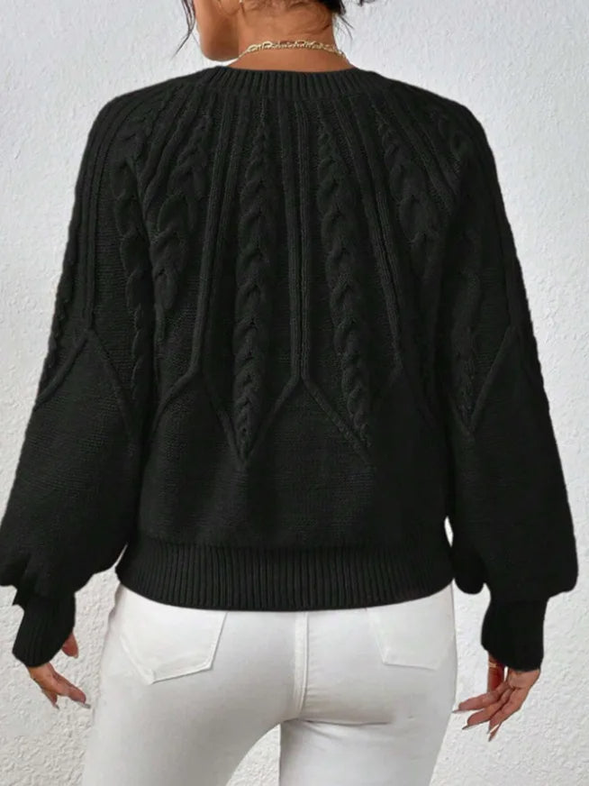 Women's cozy winter sweater, cable knit design, and trendy balloon sleeves for chic style.