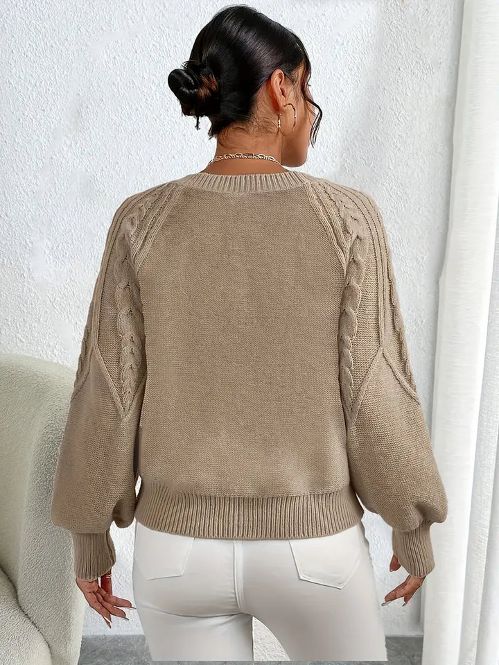 Versatile women's elegant top: cozy cable knit sweater with distinctive balloon sleeves.
