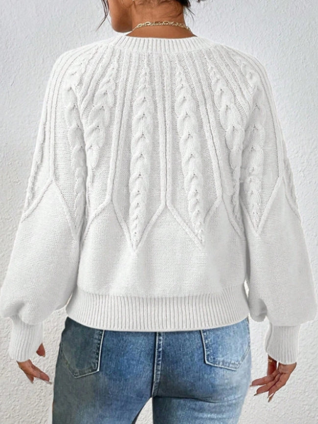 Stylish women's cropped sweater, cable knit design with elegant balloon sleeves.