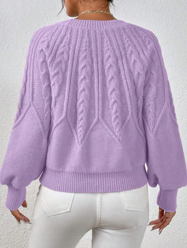 Women's fashion knitwear: chic cable knit sweater with beautiful balloon sleeves.