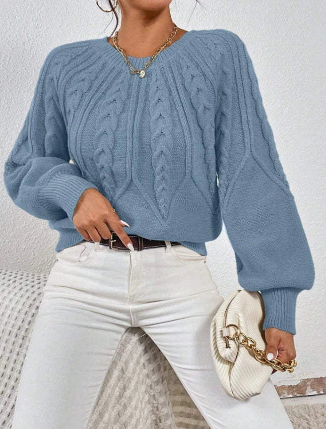 Warm women's winter sweater, cable knit pattern, and trendy balloon sleeves.