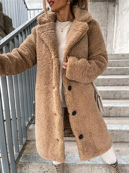 Stylish women's long casual coat with a relaxed fit and elegant button closure, perfect outerwear.