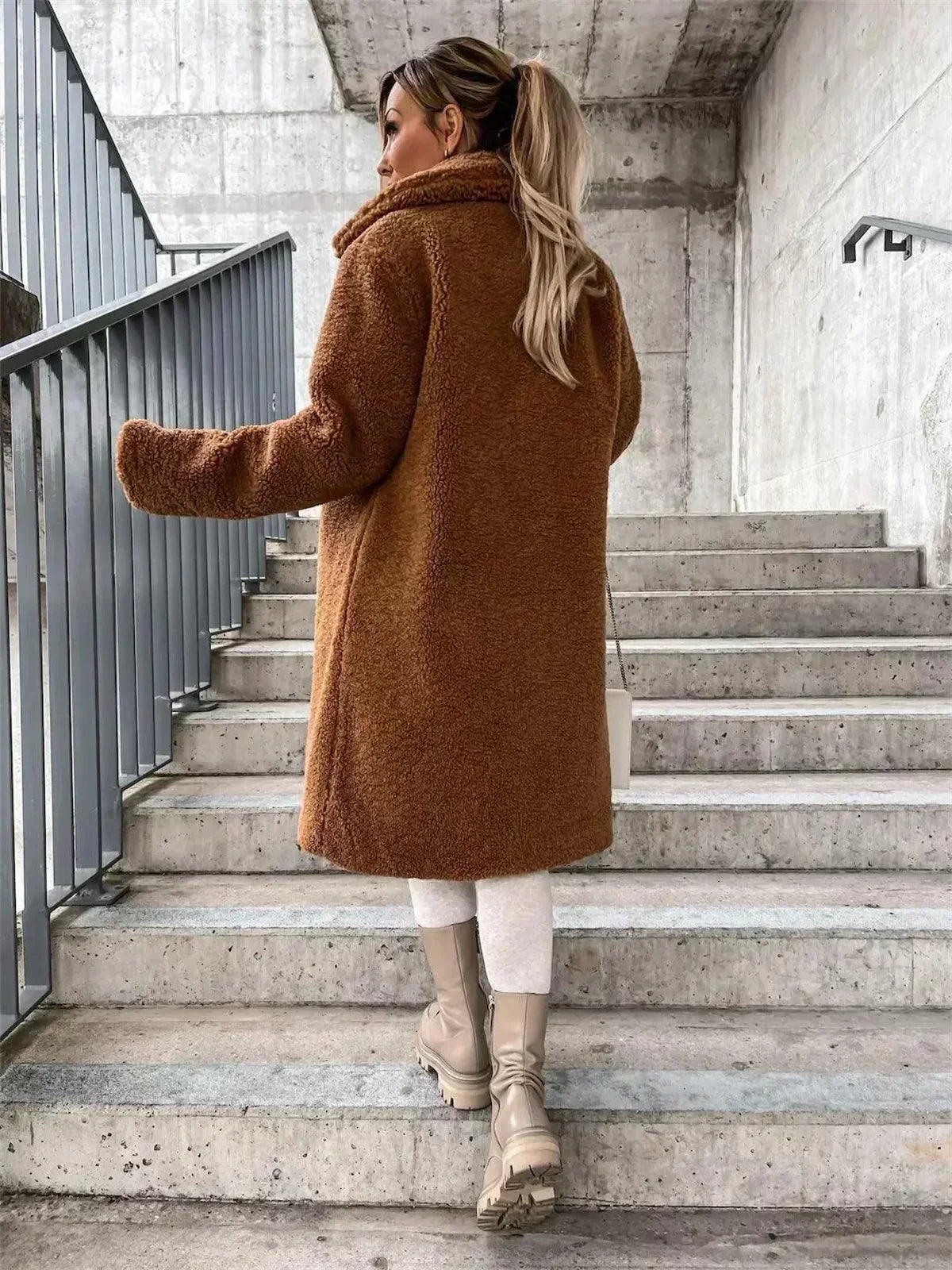 Timeless women's elegant button coat, a stylish long outerwear piece for a chic casual look.