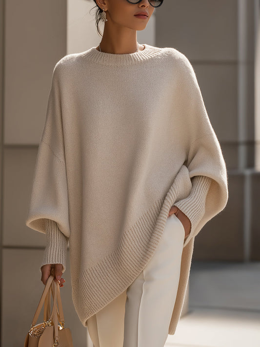 Women's elegant casual sweater with asymmetrical hem, long sleeves & relaxed fit for modern chic fashion.