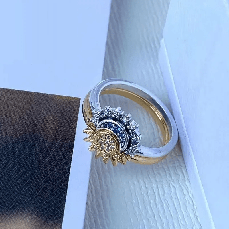 Sparkling crystal celestial sun & moon ring for women, a unique cosmic jewelry piece.