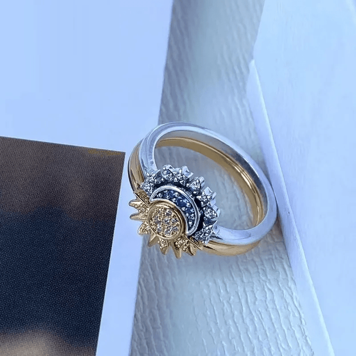 Sparkling crystal celestial sun & moon ring for women, a unique cosmic jewelry piece.