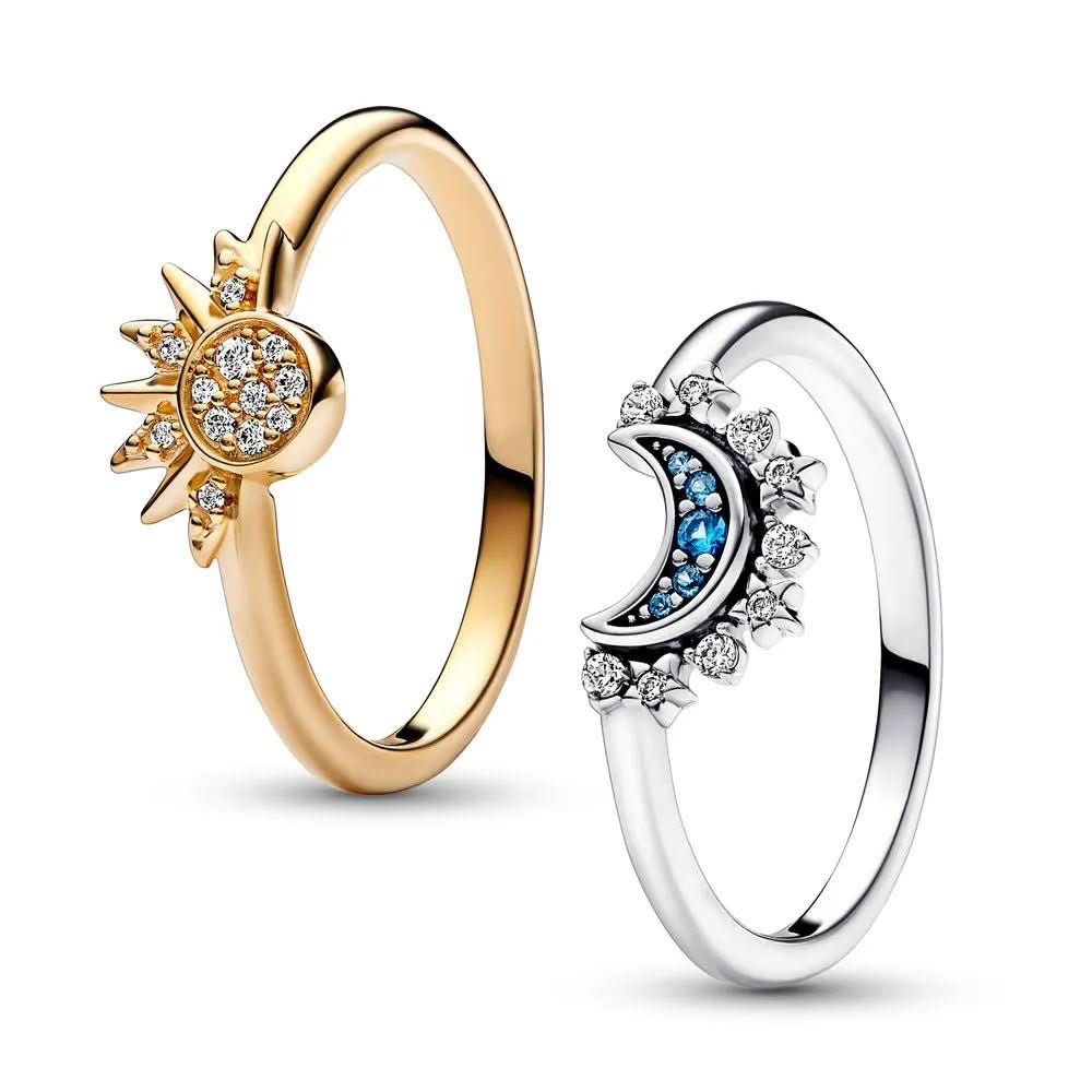 Women's statement ring featuring an intricate sun & moon design with radiant crystal details.