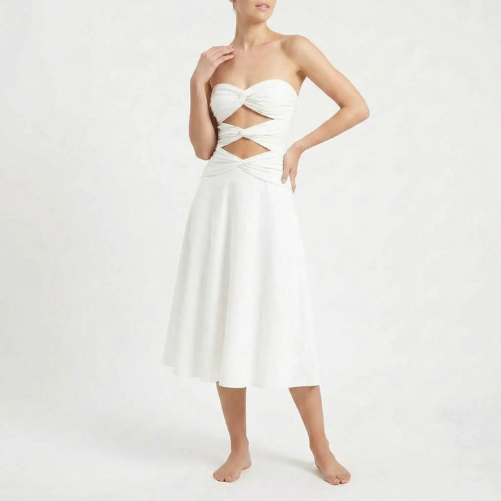 Gradient women's cutout swimsuit with flowing skirt, elegant beach and resort outfit.