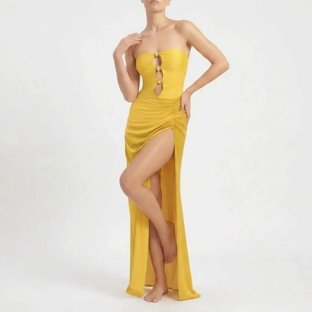 Women's fashionable cutout swimwear with a flowing maxi skirt resort set.