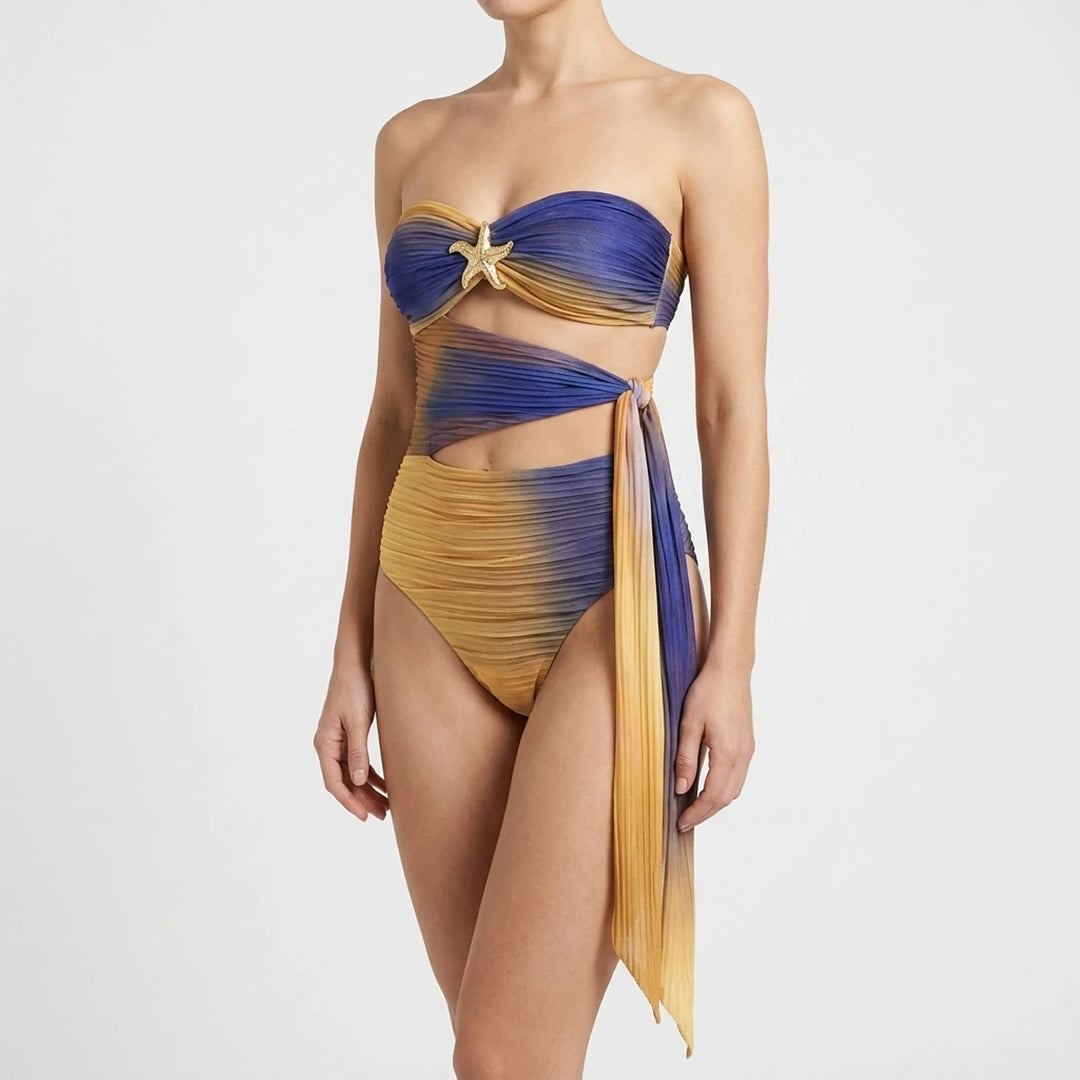 Elegant women's cutout swimsuit, flowing skirt, and starfish accent resort set for summer.
