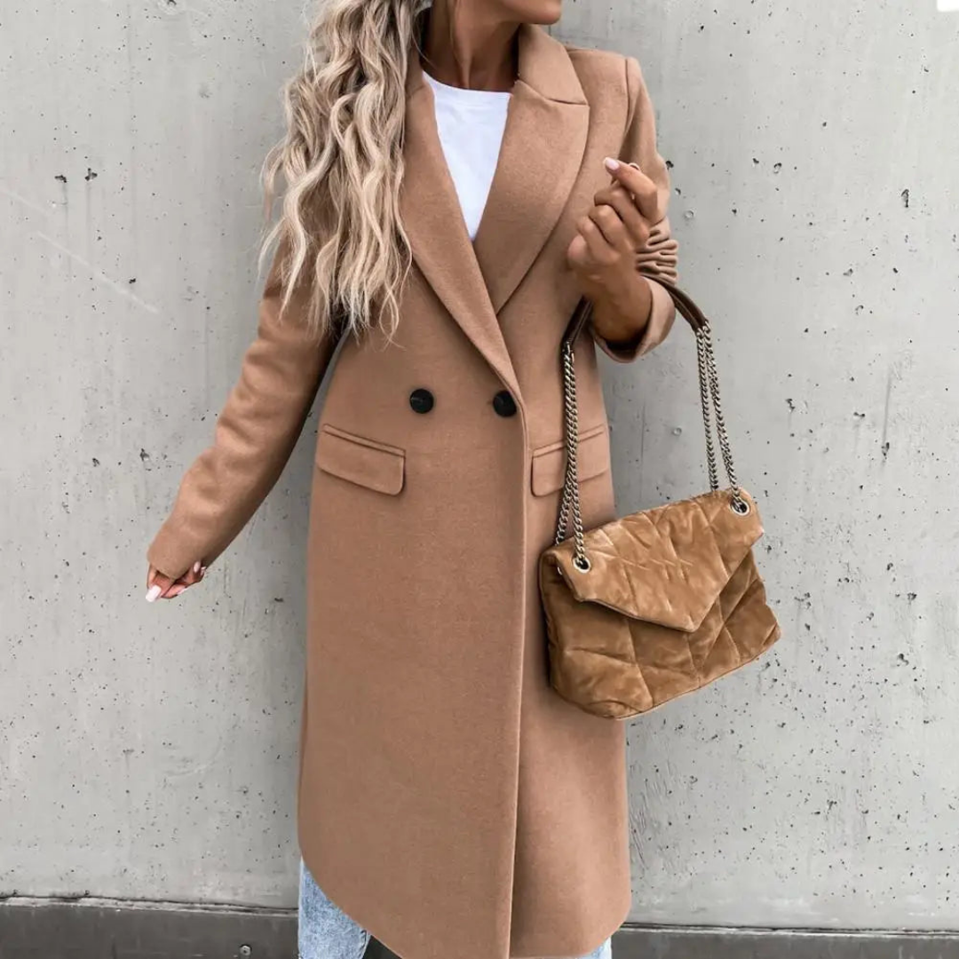 Sophisticated women's long trench coat, double-breasted with a sharp lapel. Perfect for a polished, professional look.